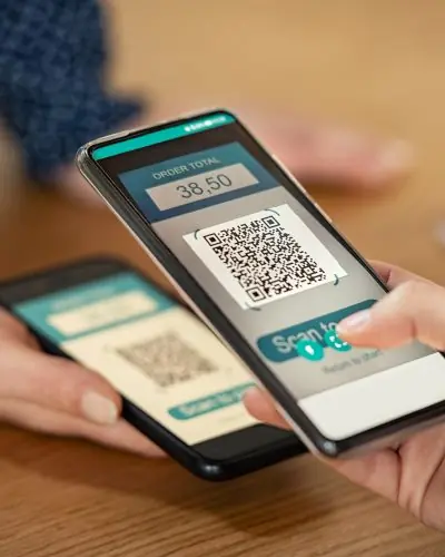 woman-scanning-qr-code-for-mobile-payment-2021-08-29-23-41-24-utc